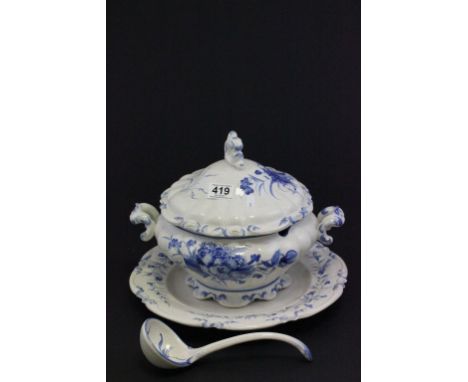 A large blue and white tureen, ladle and plate