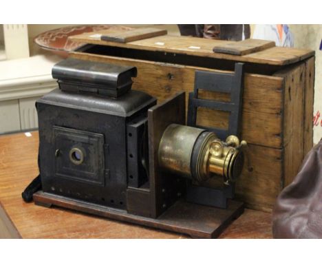 Vintage brass and tin plate slide projector in pine box