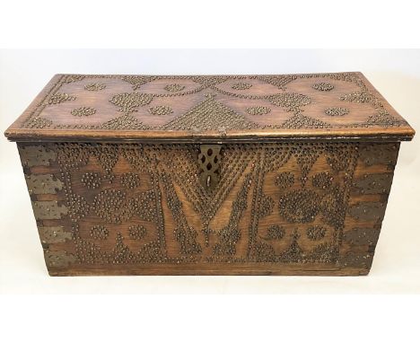 ZANZIBAR TRUNK, 19th century hardwood and brass bound with rising lid, 57cm H x 116cm x 55cm. 
