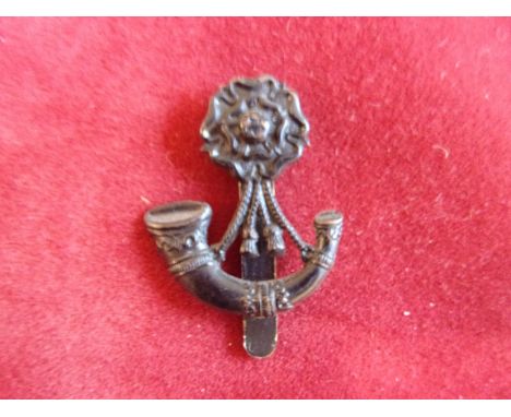 The King's (Liverpool Regiment) 6th (Rifle) Battalion WWI Cap Badge (Blackened-bronze), slider. K&amp;K: 1702