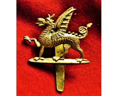 Monmouthshire Regiment 1st Battalion Forage Cap Badge (Gilding-metal), slider, worn 1908-1922. K&amp;K: 1769-Monmouthshire Re