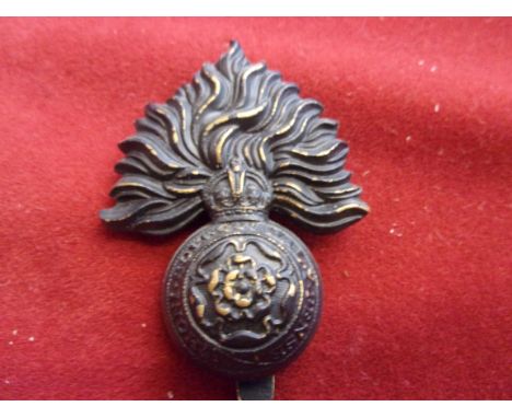 1-4th City of London Battalions (The Royal Fusiliers) WWI Other Ranks Cap Badge (Blackened-brass), two lugs. K&amp;K: 1818