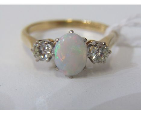 OPAL & DIAMOND 3 STONE RING, 18ct yellow gold ring set a large oval opal flanked by 2 round brilliant cut diamonds, opal appr