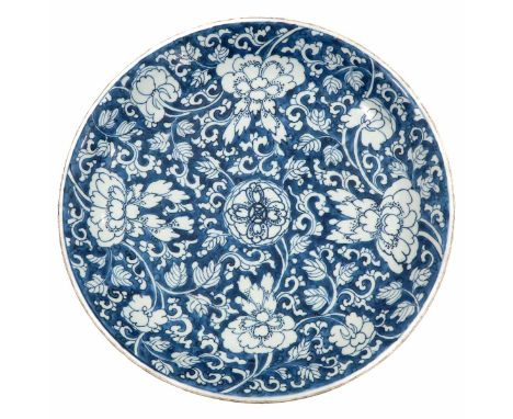 Blue ground decorated with white flowers, marked with double ring and lozenge, 39 cm. in diameter, chip.