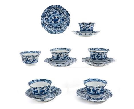 Blue and white floral decor, Kangxi mark on cups, saucers are 13 cm. in diameter, chip.