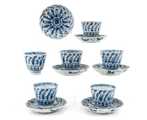 Decorated with flowers, saucers are 13 cm. in diameter, chip and hairline.