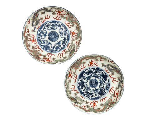 Decorated with dragons and Longevity sign in middle of plates, Kangxi mark, 18 cm. in diameter, restored. 
