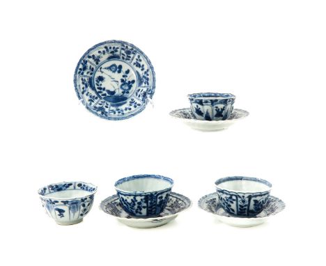 Depicting flowers in garden, 18th Century, saucers are 11 cm. in diameter, chip and hairline.
