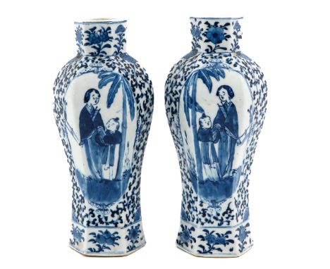 Depicting Chinese lady and boy in garden, Kangxi mark, 27 cm. tall. 
