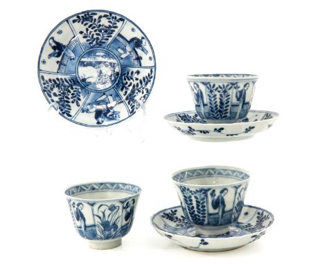 Depicting Chinese ladies with flowers, Kangxi mark, saucers are 13 cm. in diameter, chip and hairline.