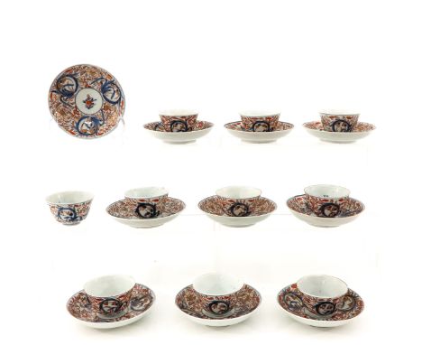 In iron red, blue and gilt floral decor, saucers are 11 cm. in diameter, chip.