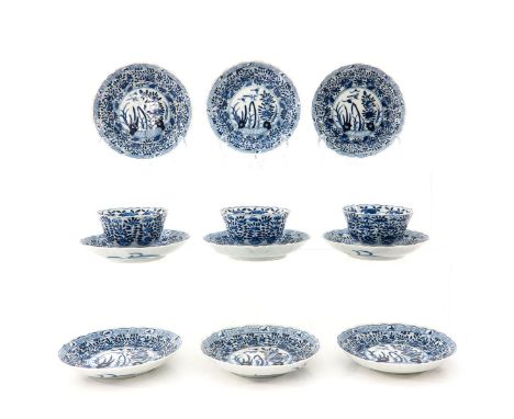 Including 3 cups and 9 saucers, blue and white floral decor, saucers are 13 cm. in diameter, chip and hairline.