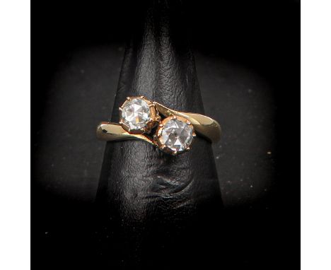 14KG, set with 2 rose cut diamonds, approximately 14 mm. in diameter, ring size 16.