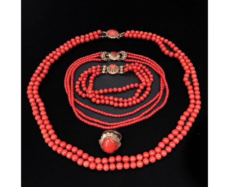 Including 2 red coral necklaces, bracelet, and 14KG ring, ring size 18, coral is 3 - 7 mm. in diameter, total weight is 106 g