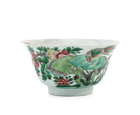 Marked with flower and double ring, 18 cm. in diameter, with restoration.