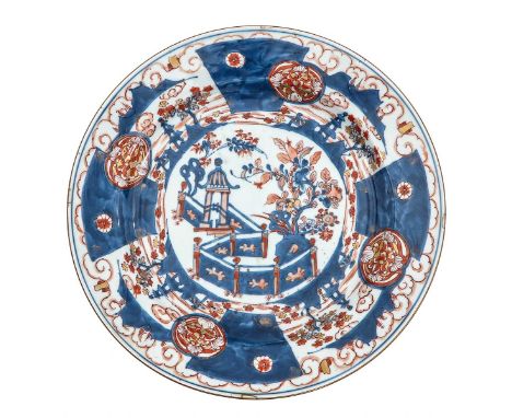 Depicting scene in garden with pagoda and flowers, marked with double ring and conch shell, 35 cm. in diameter, hairline.