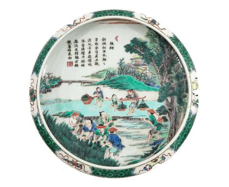 Decorated with Chinese figures working in fields, Kangxi mark, 28 cm. in diameter. 