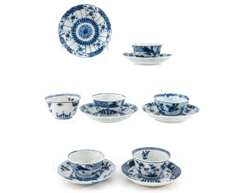 Depicting flowers and Chinese figures in garden, saucers are 11  cm. in diameter, chip and hairline.