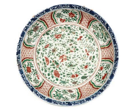 Decorated with flowers, Kangxi Mark and Period, 33 cm. in diameter, chip and hairline.
