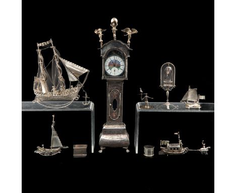 Including 18th Century man with bird and standing clock, 30 cm. tall.