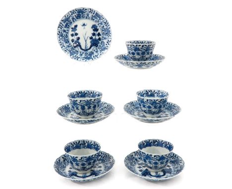 Including 5 cups and 6 saucers in blue and white floral decor, marked with double ring and jade symbol, saucers are 13 cm. in
