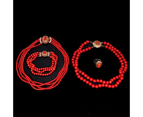Including 2 red coral necklaces, bracelet, and ring with 14KG clasp, ring size 17, coral is 3 - 7 mm. in diameter, total weig