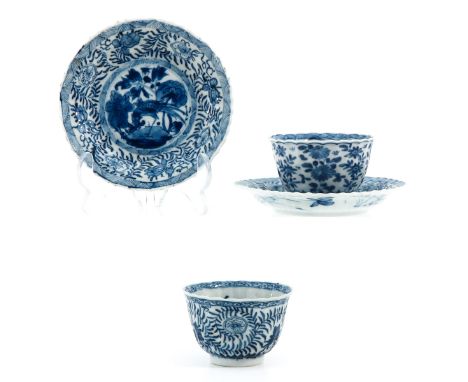 Floral decor, including marked with double ring and conch shell, saucers measure 13 cm. in diameter, hairline.