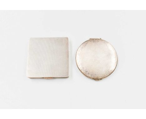 Two Silver Compacts, one circular and one square, each with an engine-turned finish, the hinged covers open to reveal a mirro