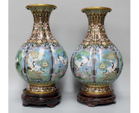 A Pari of Chinese Cloisonne Vases, 20th century, of lobed baluster form, with blue ground panels decorated with cranes and in