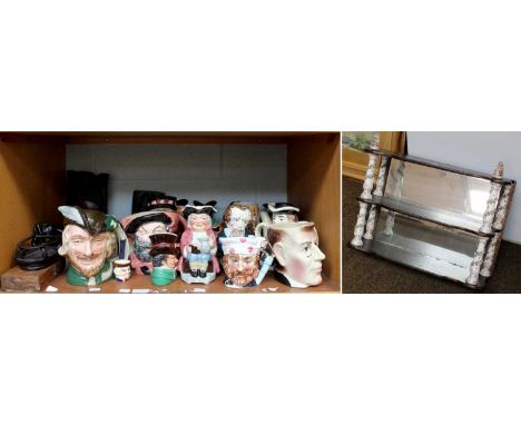 A Collection of Assorted Pottery Character Jugs, a mirrored three tier hanging shelf with column porcelain supports in the Me