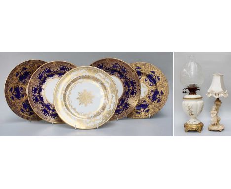 A Royal Worcester Porcelain Ivory Ground Oil Lamp, painted in gilt with trailing flowers and on faux Chinese pierced gilt met