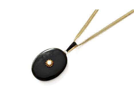 An Onyx, Enamel and Pearl Locket, the oval onyx locket with a pearl centrally in a yellow claw setting, suspended by a black 