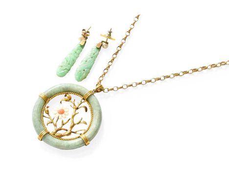 A Jade and Coral Pendant on Chain, the circular jade frame with a yellow foliate scene centrally, with a coral flower, on a 9
