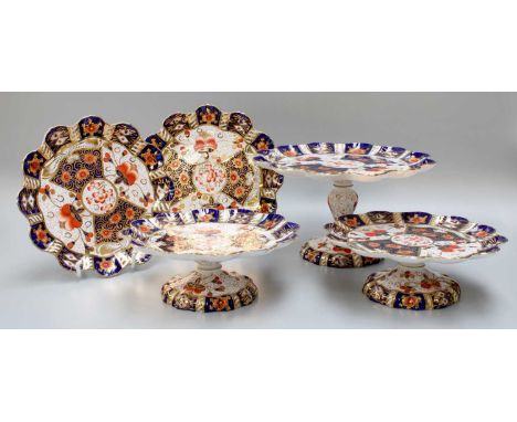 A Davenport Porcelain Dessert Service, decorated in the Derby Witches pattern 2614, retailers stamp for Pointons, comprising 