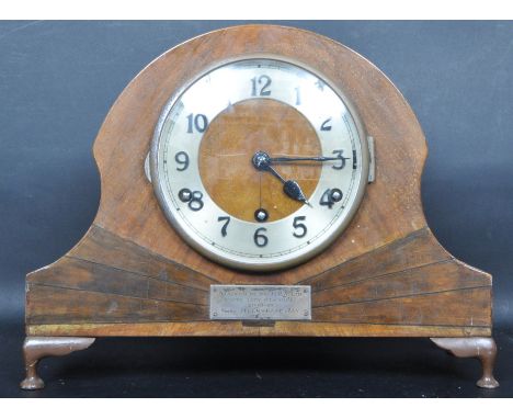 An Art Deco circa 1930s early 20th century walnut cased Napoleons hat mantel clock having sunburst decoration to the case. Th