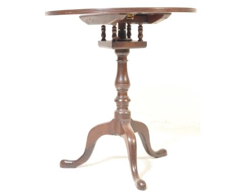 An 18th century George III mahogany tilt top table having a circular table top with birdcage mechanism raised on a tripod bas