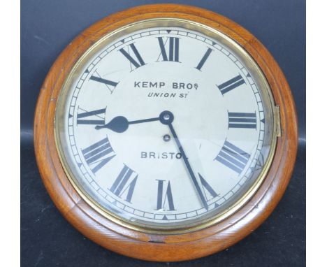 A late 19th / early 20th Century mahogany cased station wall clock having a round face with roman numerals to the chapter rin