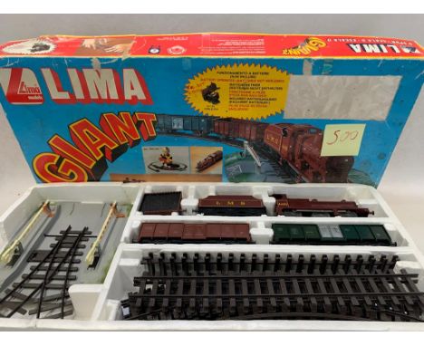 LIMA 0 gauge Giant Set with LMS battery operated 0-6-0 & tender. 2 open trucks, track, level crossing & points    Condition 2