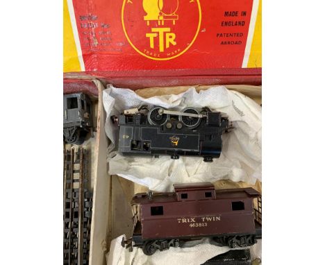 TRIX twin with 0-4-0 engine no 48 & tender, black. 2 goods tricks, guards van, Esso tanker, bogey freight wagon, box car & ca