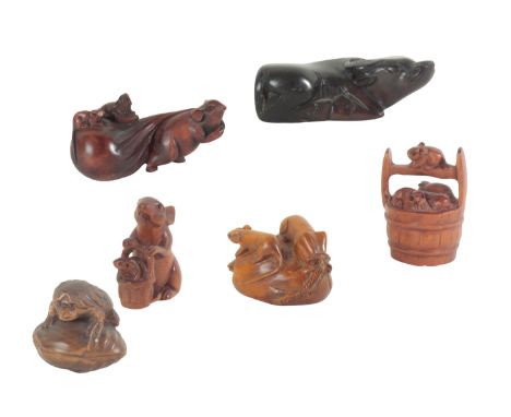 A COLLECTION OF SIX JAPANESE NETSUKE including a hardstone water buffalo, 7.5cm long, a late 19th century netsuke modelled as