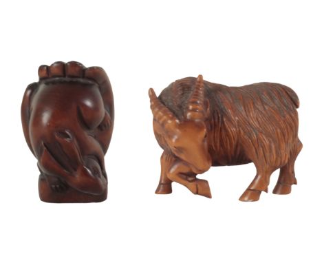 TWO JAPANESE CARVED WOOD NETSUKE one example modelled as a goat, signed to the base of a foot, 4cm high, the other, Meiji per
