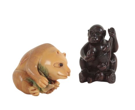 TWO JAPANESE NETSUKE including a carved tagua nut example, in the form of a panda, 3.5cm high, and another in the form of a m