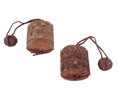 TWO JAPANESE CARVED WOOD THREE-CASE INROS one example, decorated in relief with monkeys to the body, 7.5cm high, the other 8c