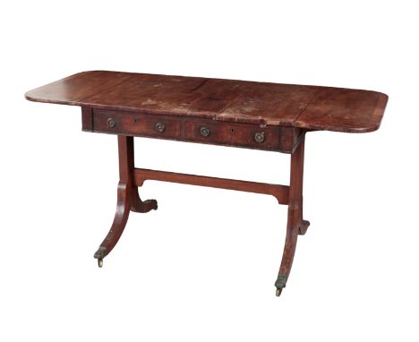 A REGENCY MAHOGANY AND CROSS-BANDED SOFA TABLE early 19th century, with two frieze drawers to one side and two false drawers 