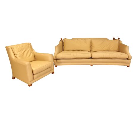 A KNOLE SOFA AND MATCHING CHAIR upholstered in fawn corded satin, on light oak square front legs, brass caps and castors, the