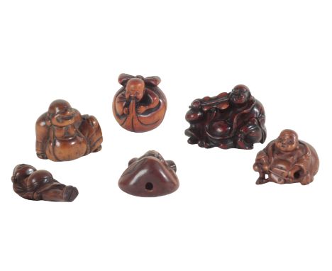 A GROUP OF SIX JAPANESE CARVED WOOD NETSUKE including a standing hotei, probably Edo period, the tallest 6cm high, a hotei wi