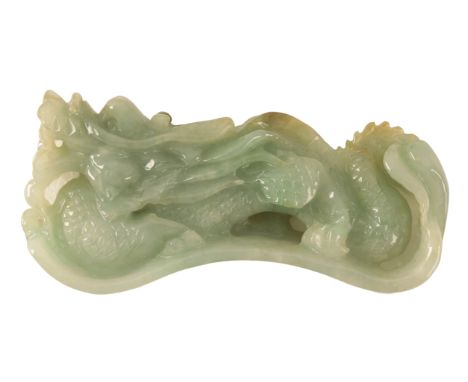 A CHINESE RARE JADE PAPERWEIGHT Qing, 19th century, carved as a dragon with huanghuali wood stand, c.8cm wide x 4cm high