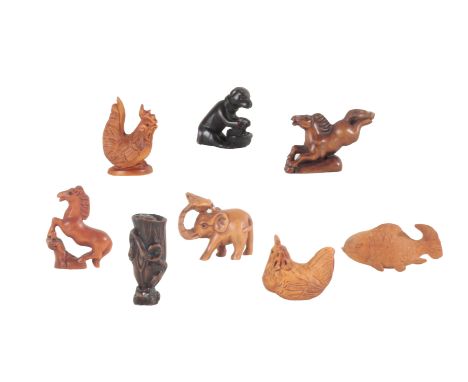 A COLLECTION OF EIGHT NETSUKE partially signed, the tallest, adorned with a frog snake and snail, measures 5.5cm high (8)Prov
