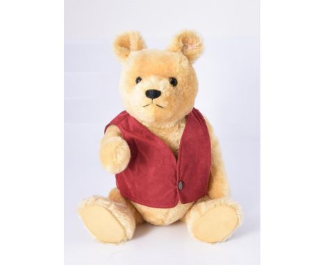 
	
		STEIFF, WINNIE THE POOH, 03289, CIRCA 2004 
		Limited edition of 5,000, soft gold mohair, red suede vest, gilt button in