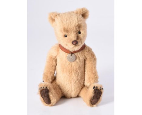 
	
		R. JOHN WRIGHT, TAG BEAR, LOO, 147/500, CIRCA 2003
		Shaded golden brown mohair, with a brown leather collar and circula